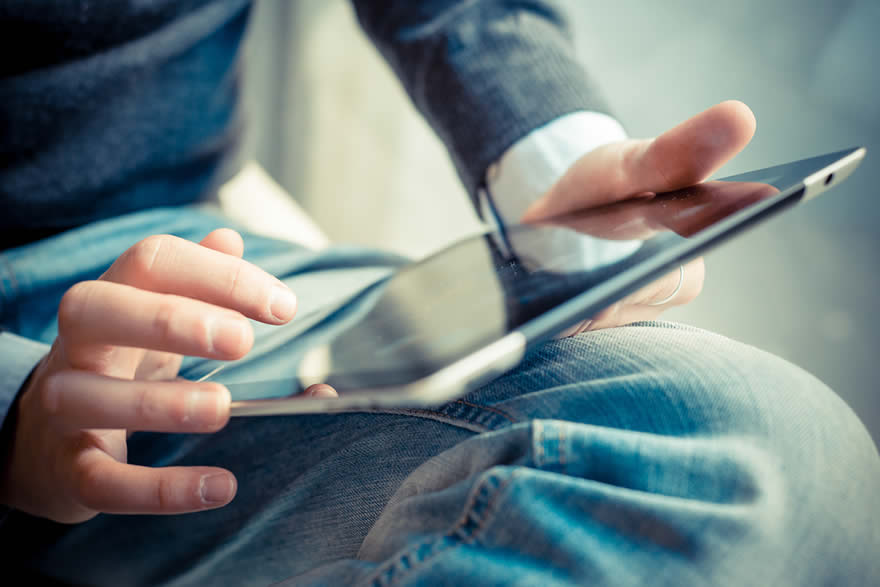 Man using tablet to purchase on Amazon